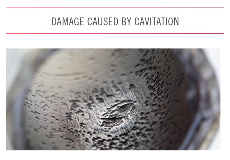 Close up image of a hole with damage caused by cavitation